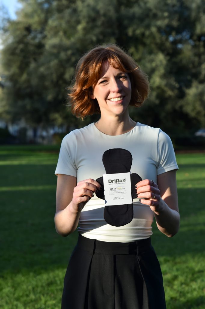 Laura, DriRun’s founder, holding the liner she developed